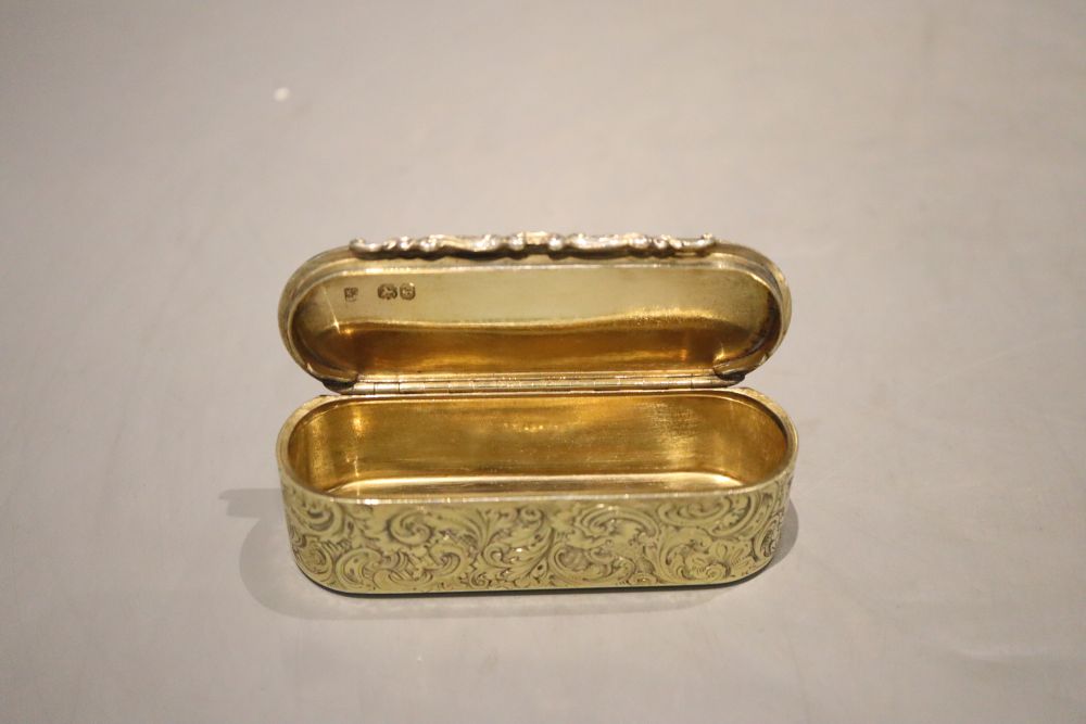 An early Victorian engraved silver gilt oval snuff box, Rawlings & Summers, London, 1837, 98.8 grams.